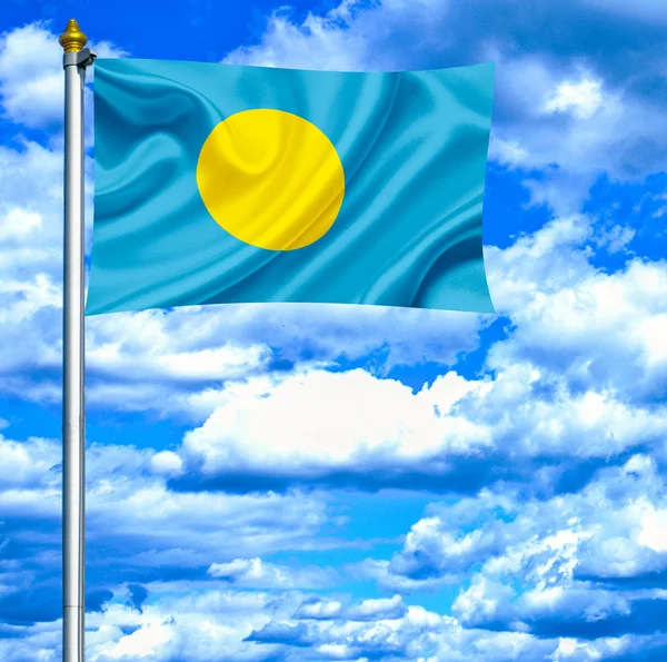 Palau macha flagą przeciw błękitne niebo — Zdjęcie stockowe