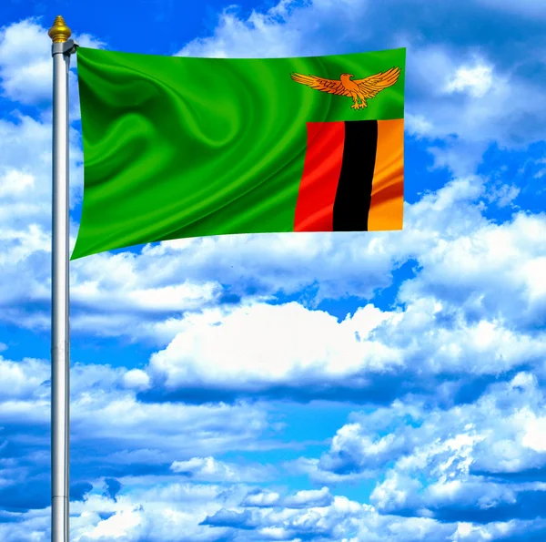 Zambia viftande flagga mot blå himmel — Stockfoto