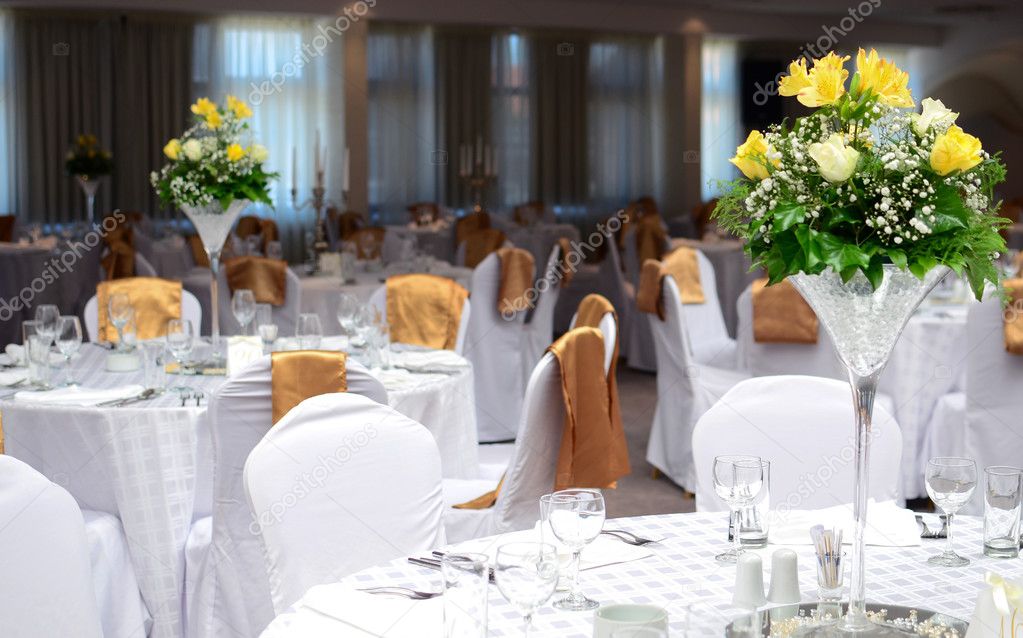 Fancy table set for a wedding with beautiful yellow flowers