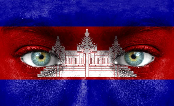 Human face painted with flag of Cambodia — Stock Photo, Image