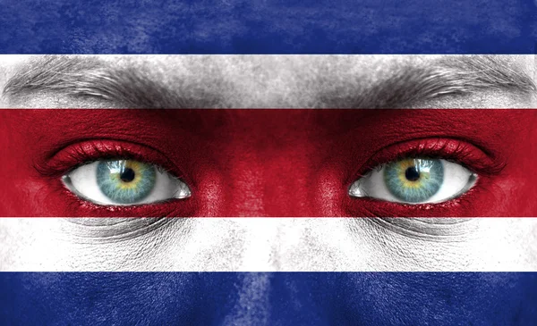Rosto humano pintado com bandeira da Costa Rica — Fotografia de Stock