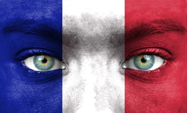 Human face painted with flag of France — Stock Photo, Image