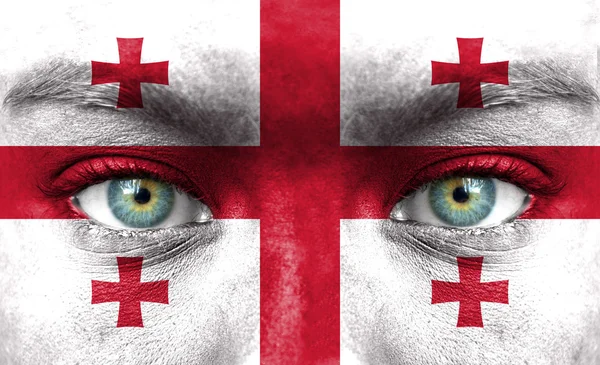 Human face painted with flag of Georgia — Stock Photo, Image