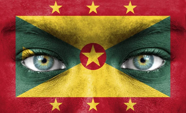 Menselijk gezicht beschilderd met vlag van grenada — Stockfoto