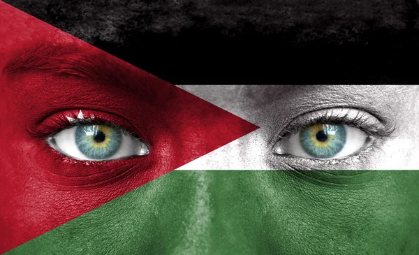 Ludzka twarz malowane z flaga Jordanii — Zdjęcie stockowe