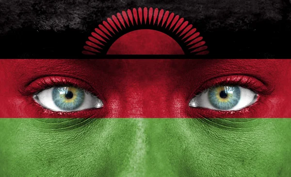 Cara humana pintada con bandera de Malawi — Foto de Stock