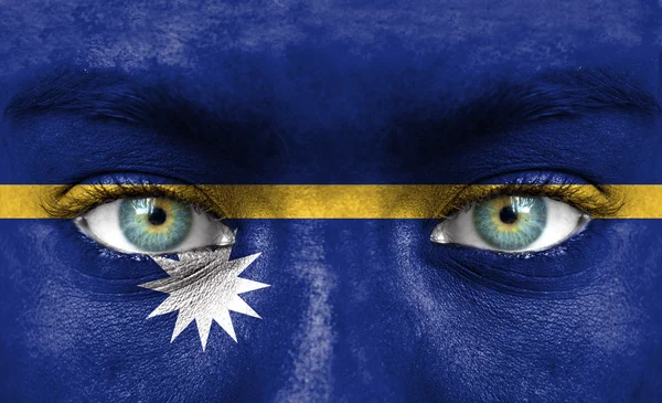 Human face painted with flag of Nauru — Stock Photo, Image