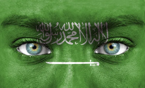 Ανθρώπινο πρόσωπο ζωγραφισμένα με σημαία της Σαουδικής Αραβίας — Φωτογραφία Αρχείου