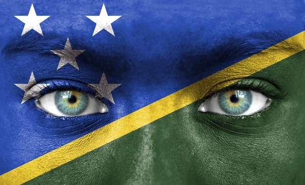 Rosto humano pintado com bandeira das Ilhas Salomão — Fotografia de Stock