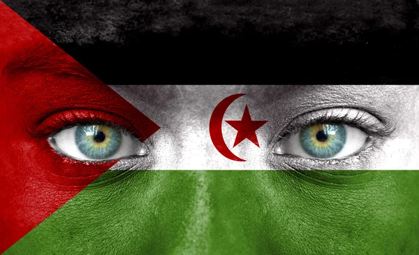 Human face painted with flag of Western Sahara — Stock Photo, Image