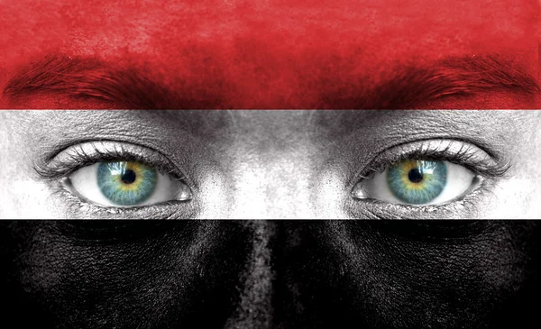 Human face painted with flag of Yemen — Stock Photo, Image