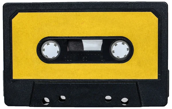 Желтая винтажная ретро-кассетная лента, изолированная на белом — стоковое фото