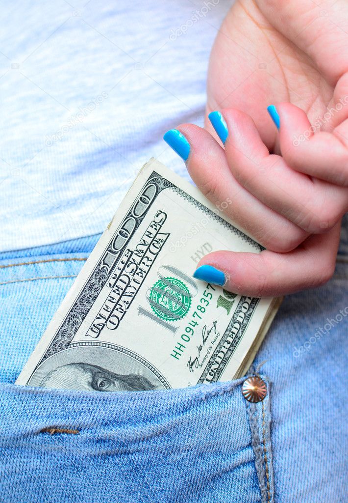 Woman hand taking money from jeans back pocket