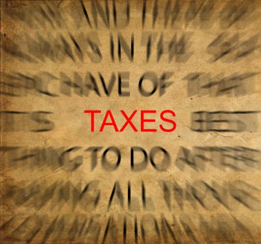 Blured text on vintage paper with focus on TAXES clipart