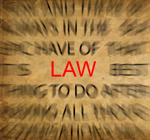 Blured text on vintage paper with focus on LAW — Stock Photo, Image