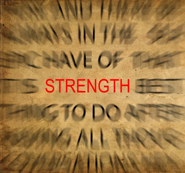 Blured text on vintage paper with focus on STRENGTH — Stock Photo, Image