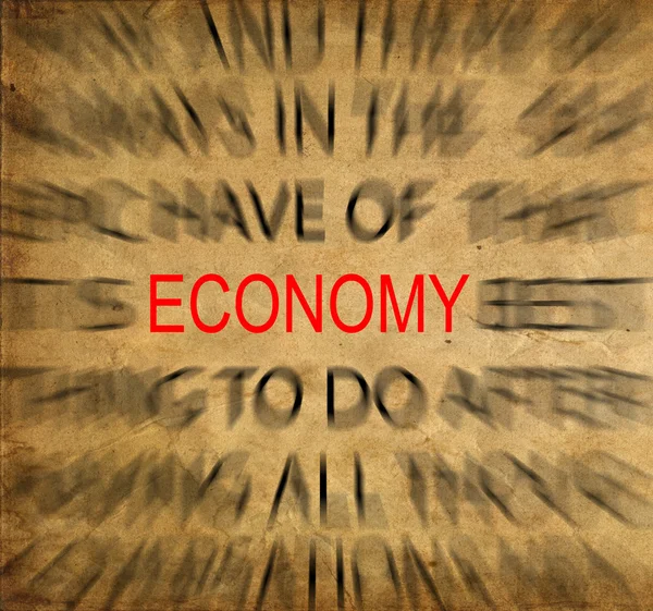 経済に焦点を当てるとビンテージの紙の上 blured テキスト — ストック写真