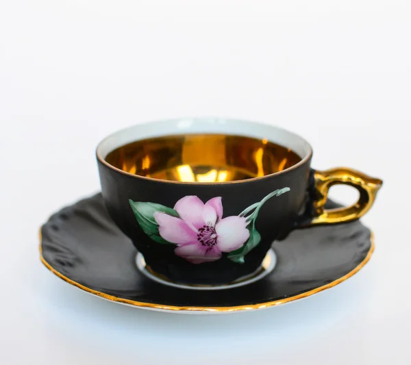 Mooie bloemen vintage cup met plaat geïsoleerd — Stockfoto