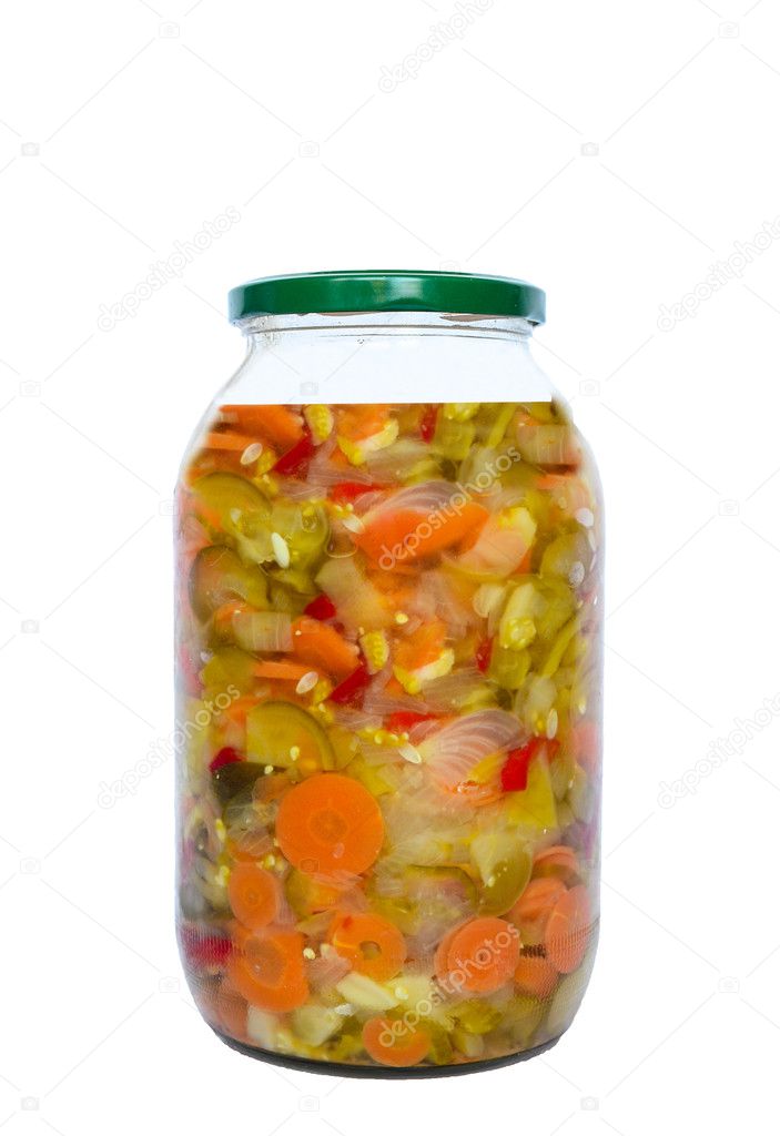 Preserved vegetables in glass jar isolated on white background