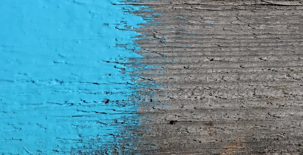 Blue paint on old wooden background — Stock Photo, Image