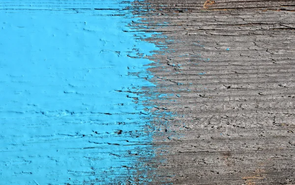 Синя фарба на старому дерев'яному фоні — стокове фото