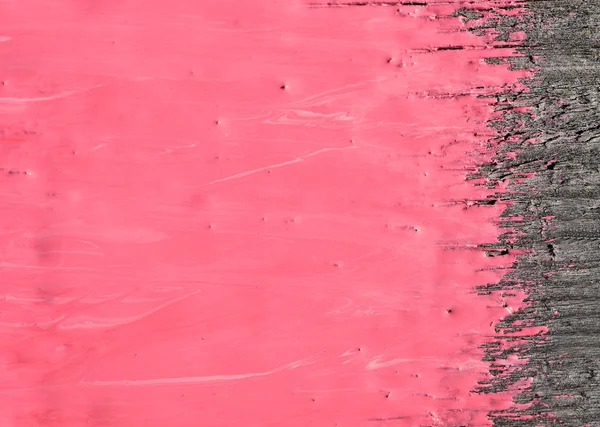Розовая краска на старом деревянном фоне — стоковое фото