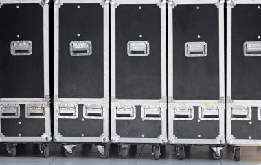 A line of mobile containers for transportation of concert equipm clipart