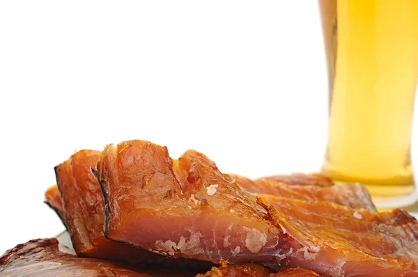 Smoked fish and cup of beer on a white background — Stock Photo, Image