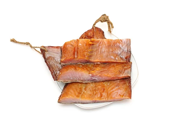 Trozos de pescado ahumado sobre un fondo blanco —  Fotos de Stock