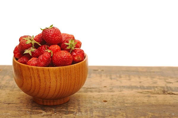 Red strawberries on old wood table — Stock Photo, Image