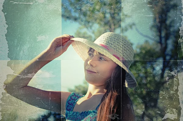Lonely girl in a white hat looks into the distance. Photo in old — Stock Photo, Image