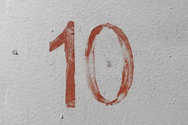 10 - alte braune handgeschriebene Zahl auf silbernem Grunge-Hintergrund — Stockfoto