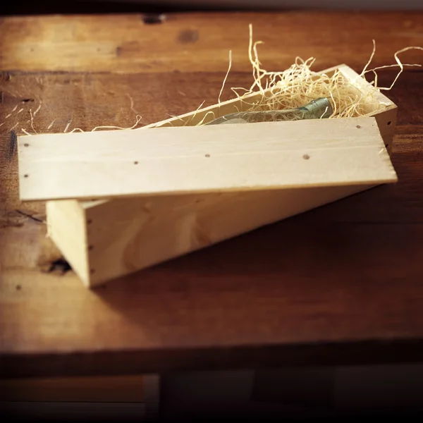 stock image Bottle in a wooden box