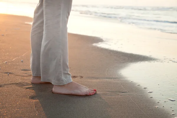 stock image Barefoot woman on the beach