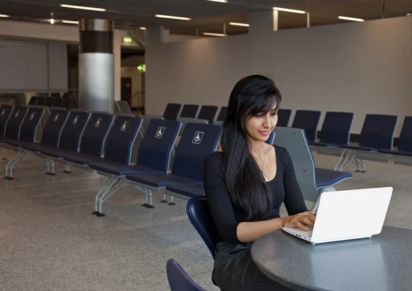 Woman Using Notebook in the Airport Terminal — Stock Photo, Image