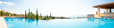 Luxury swimming pool. Panoramic image clipart