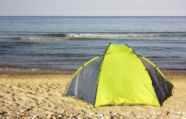 Colorful tent on the beach clipart