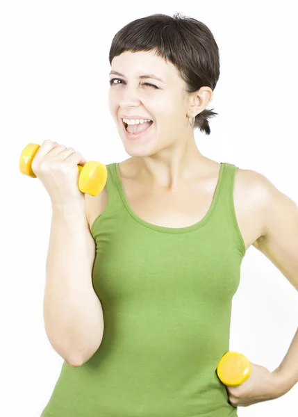 Glückliche junge Frau während der Fitnesszeit und beim Hantelheben — Stockfoto