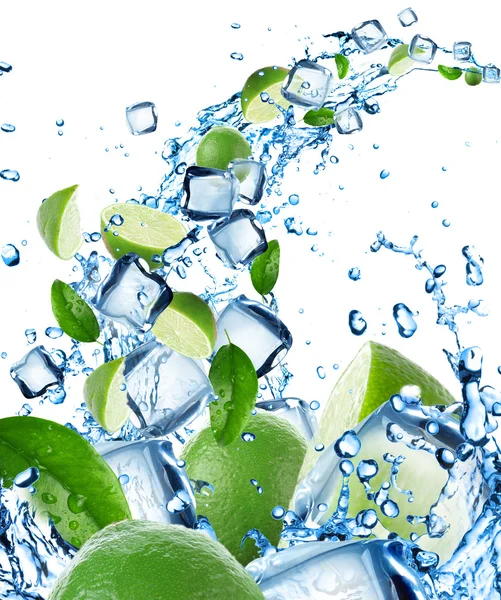 Fresh limes in water splash with ice cubes — Stock Photo, Image