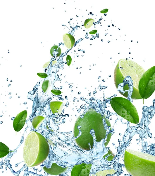 Fresh limes in water splash — Stock Photo, Image