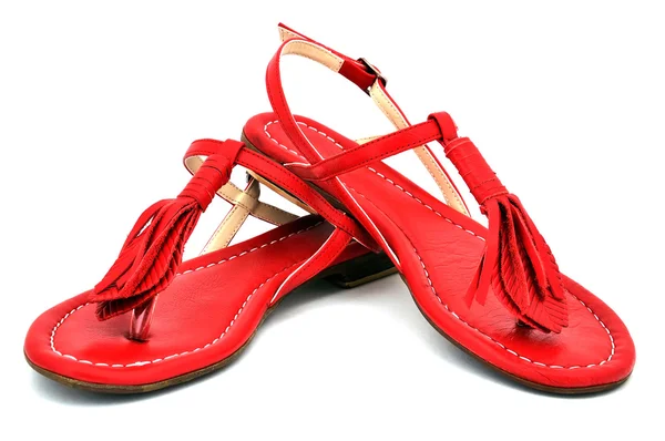 Две красные сандалии — стоковое фото