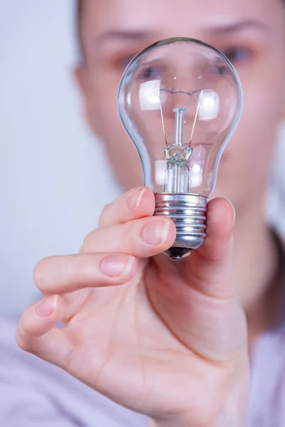Woman holding electrical lamp — Stock Photo, Image