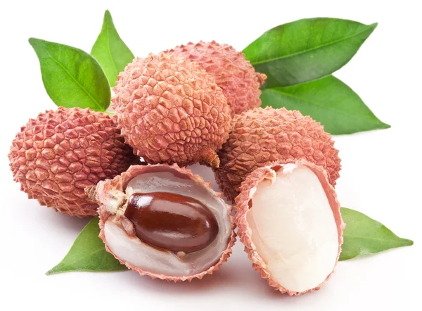 Lychee with leaves on a white background. — Stock Photo, Image