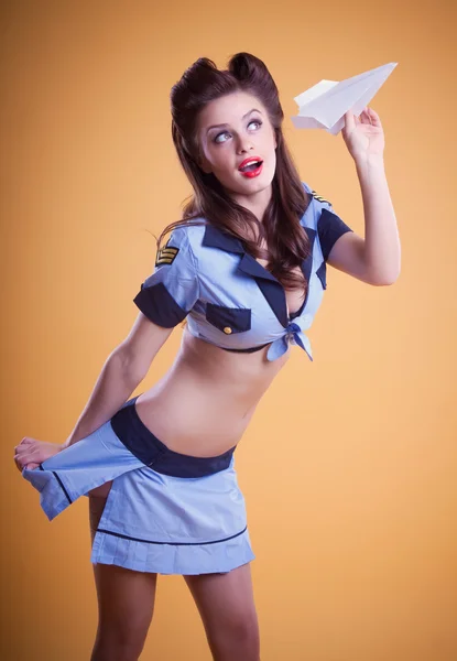 Beautiful flight attendant in a retro pin up style — Stock Photo, Image