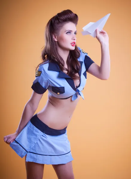 Beautiful flight attendant in a retro pin up style — Stock Photo, Image