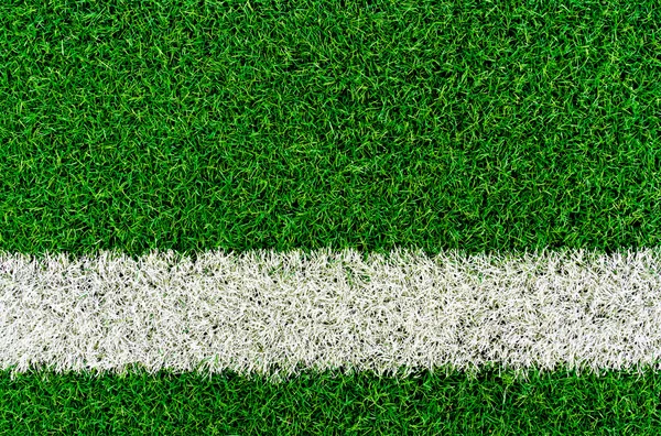 White stripe on the green grass field — Stock Photo, Image