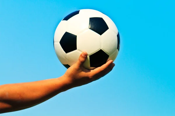 stock image Ball in hand and blue sky background