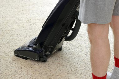 Person Vacuuming Carpet clipart