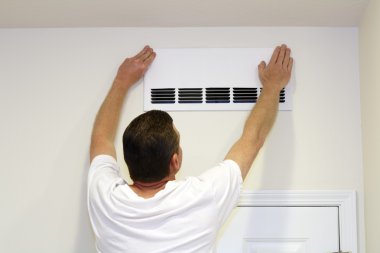 Man Covering Air Vent clipart