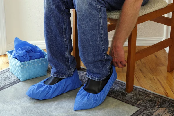 Person Putting on Booties — Stock Photo, Image